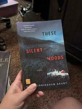 These Silent Woods Paperback Novel - Dark Forest Cover with Red Accent
